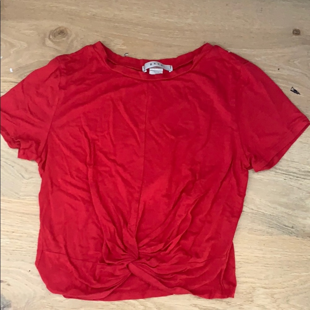 red t-shirt that is tied in the front